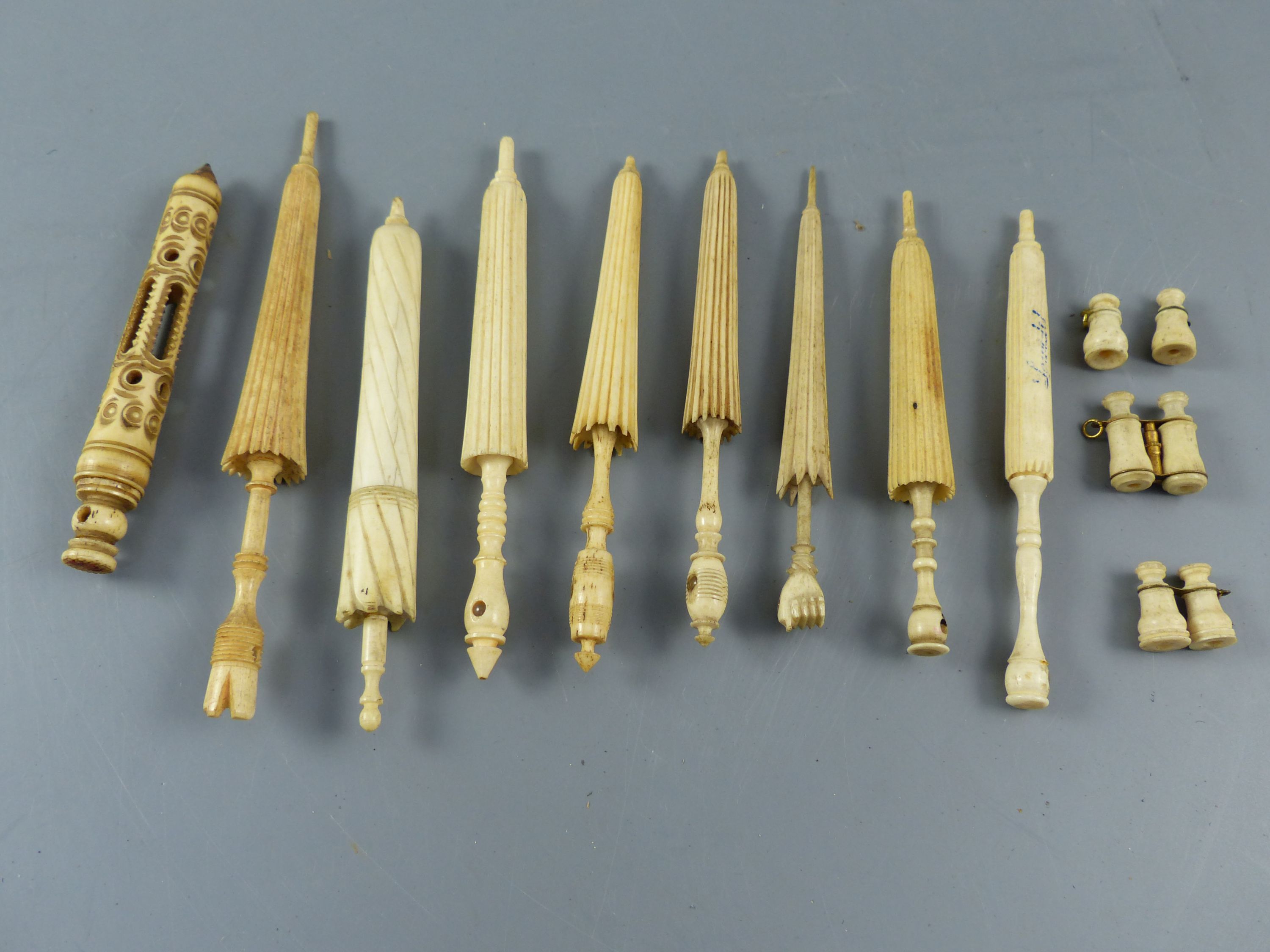 A collection of 19th century turned ivory and bone needle cases